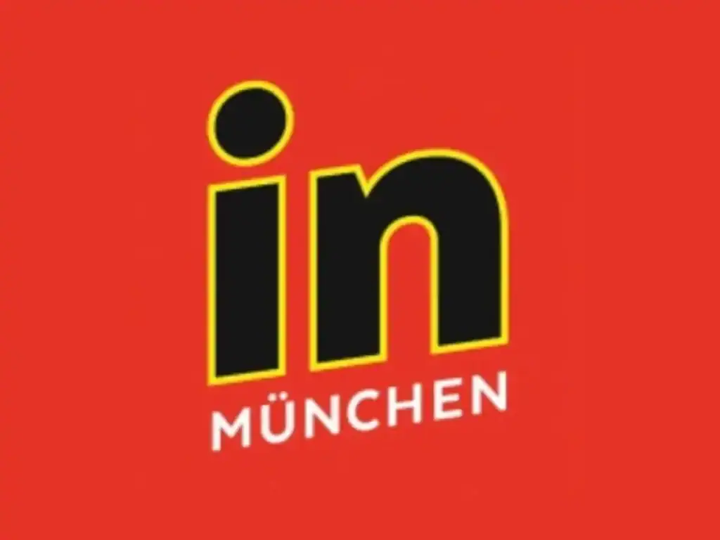 Logo 'in München' auf rotem Hintergrund